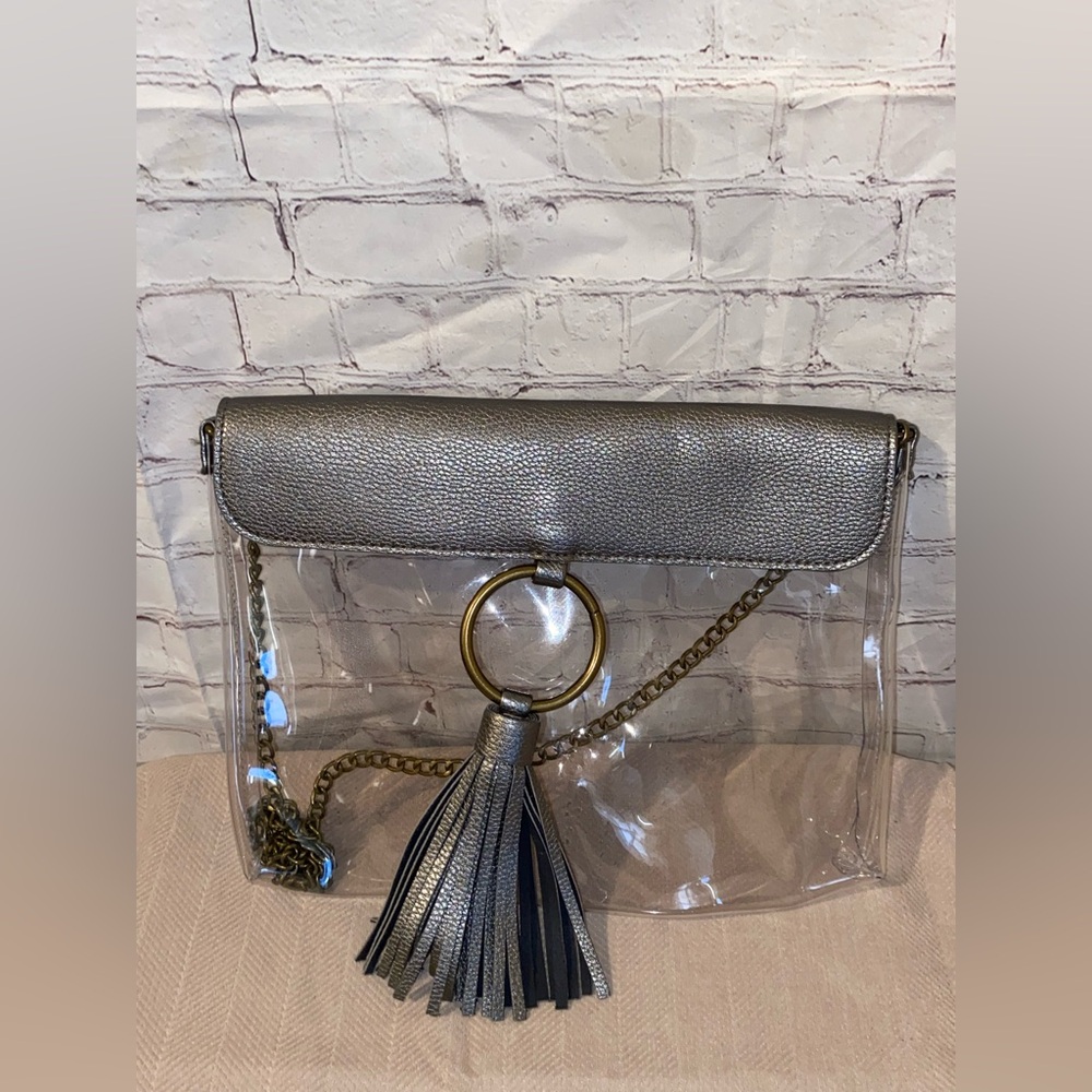 M.B. Greene Clear Crossbody Bag with Metallic Silver Flap and Tassel Accent